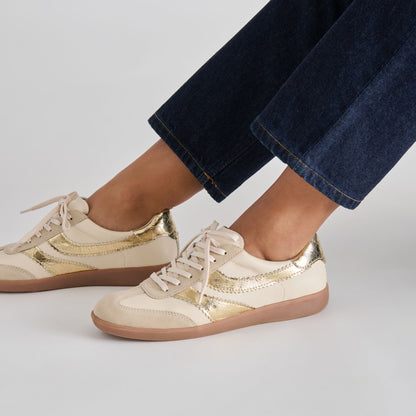 Merit White Gold Leather Sneakers | Dolce Vita Essential